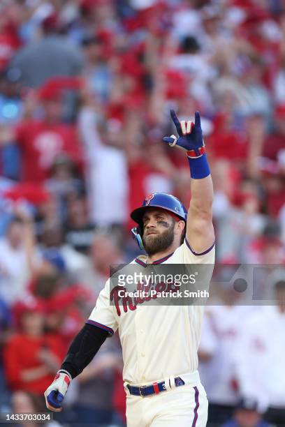 Bryce Harper of the Philadelphia Phillies celebrates a home run against the Atlanta Braves during the eighth inning in game four of the National...