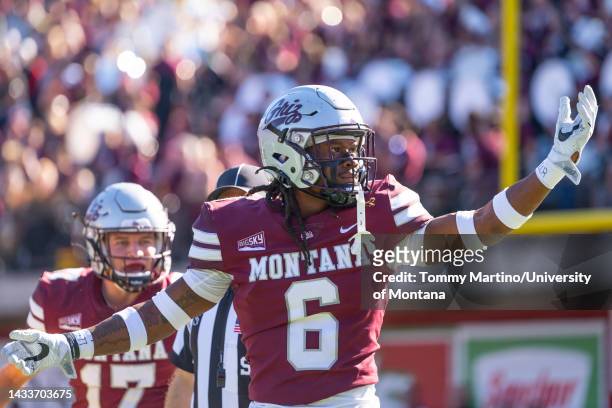 Justin Ford of the Montana Grizzlies gestures to the crowd after a third down stop during a college football game against the University of Idaho...