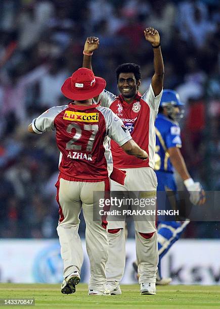 Kings XI Punjab Bowler Parvinder Awana celebrates the wicket of Mumbai Indians Batsman Kieron Pollard during the IPL Twenty20 cricket match between...