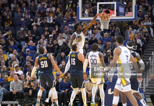James Wiseman of the Golden State Warriors goes up for a slam dunk against the Denver Nuggets during the first half of an NBA basketball game at...