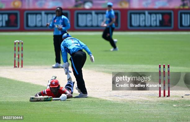 Hayley Matthews of the Renegades is run out by Tegan McPharlin of the Strikers during the Women's Big Bash League match between the Melbourne...