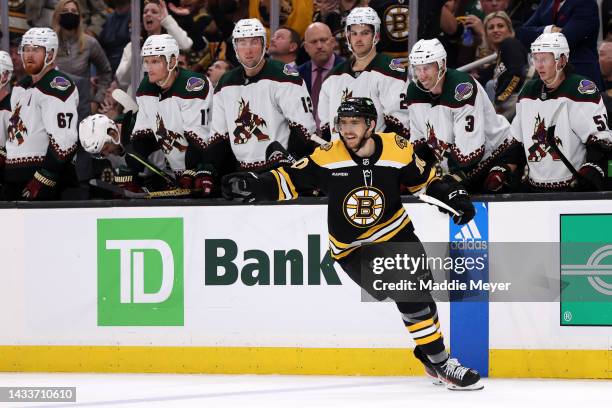 Greer of the Boston Bruins celebrates after scoring a goal against the Arizona Coyotes during the third period at TD Garden on October 15, 2022 in...