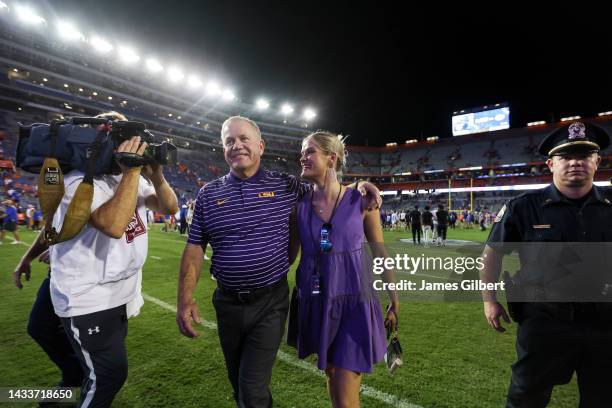 Head coach Brian Kelly of the LSU Tigers reacts with his daughter Grace Kelly after defeating the Florida Gators 45-45 in a game at Ben Hill Griffin...