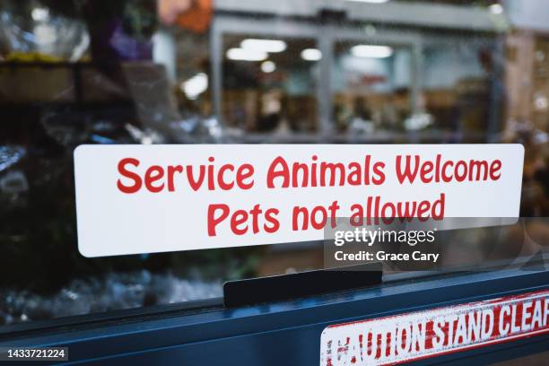 no pets allowed sign at grocery store - service animal stock pictures, royalty-free photos & images