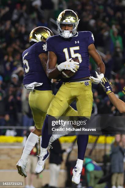 Tobias Merriweather of the Notre Dame Fighting Irish celebrates a touchdown reception with Joe Wilkins Jr. #5 against the Stanford Cardinal during...