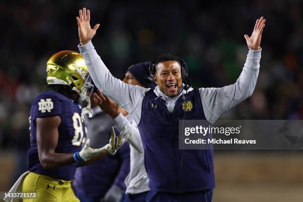 Head coach Marcus Freeman of the Notre Dame Fighting Irish celebrates a touchdown against the Stanford Cardinal during the second half at Notre Dame...