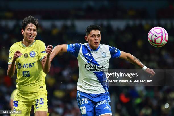 Jürgen Damm of America struggles for the ball against Ivo Vázquez of Puebla during the quarterfinals second leg match between America and Puebla as...