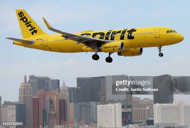 Spirit Airlines plane lands at Harry Reid International Airport on October 15, 2022 in Las Vegas, Nevada. Holiday airfare prices are expected to be...