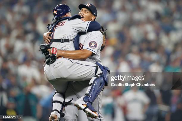 Luis Garcia of the Houston Astros reacts with Christian Vazquez after defeating the Seattle Mariners 1-0 in game three of the American League...