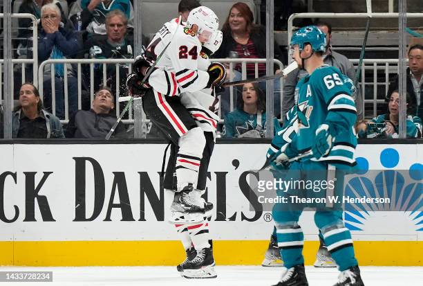 Sam Lafferty and Jason Dickinson of the Chicago Blackhawks celebrates after Lafferty scored a goal against the San Jose Sharks in the second period...