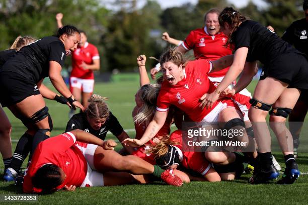 Wales celebrate a try to Sioned Harries of Wales during the Pool A Rugby World Cup 2021 match between Wales and New Zealand at Waitakere Stadium on...