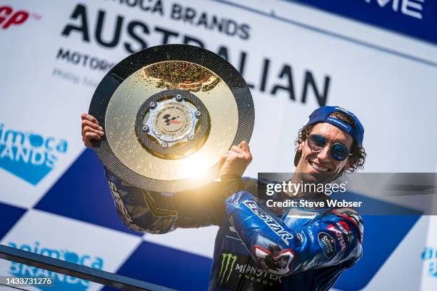 Race winner Alex Rins of Spain and Team SUZUKI ECSTAR celebrates his win with his trophy on the podium with his trophy during the race of the MotoGP...