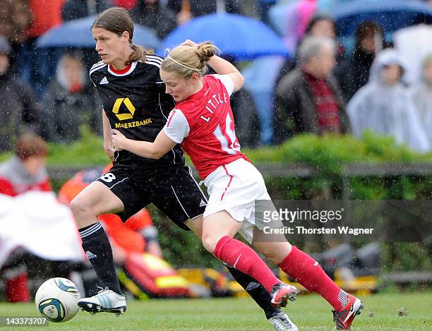 Kerstin Garefrekes of Frankfurt battles for the ball with Kim Little of Arsenal during the UEFA Women's Champions League Semi Final match between...