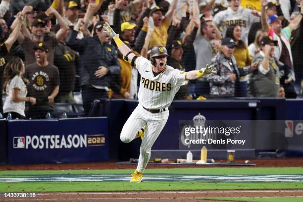 Jake Cronenworth of the San Diego Padres celebrates after hitting a two-run RBI single during the seventh inning against the Los Angeles Dodgers in...