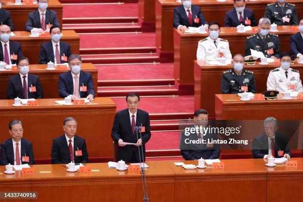 Chinese Premier Li Keqiang speaks beside Chinese President Xi Jinpin , Chinese former President Hu Jintao and Politburo Standing Committee members...