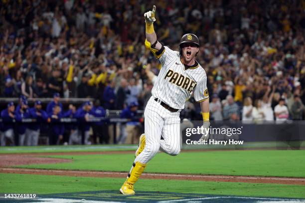 Jake Cronenworth of the San Diego Padres celebrates after hitting a two-run RBI single during the seventh inning against the Los Angeles Dodgers in...