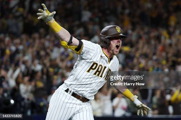 Jake Cronenworth of the San Diego Padres celebrates after hitting a two-run RBI single during the seventh inning against the Los Angeles Dodgers in...