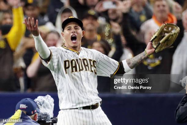 Manny Machado of the San Diego Padres celebrates defeating the Los Angeles Dodgers 5-3 in game four of the National League Division Series at PETCO...