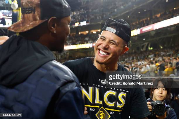 Manny Machado of the San Diego Padres celebrates defeating the Los Angeles Dodgers 5-3 in game four of the National League Division Series at PETCO...