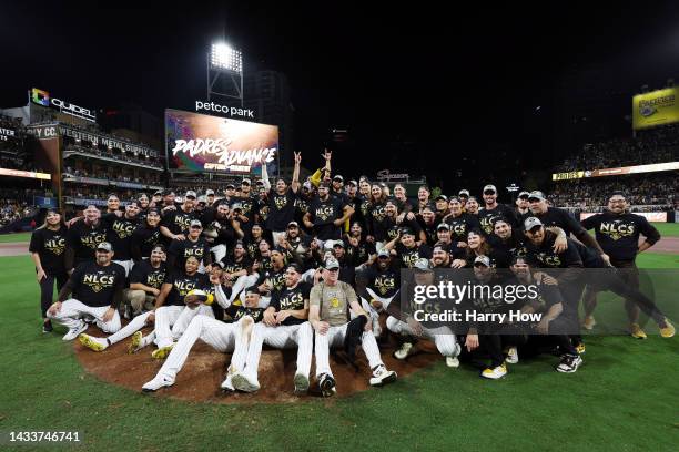 The San Diego Padres pose after defeating the Los Angeles Dodgers 5-3 in game four of the National League Division Series at PETCO Park on October...