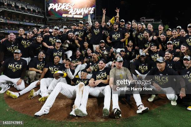 The San Diego Padres pose after defeating the Los Angeles Dodgers 5-3 in game four of the National League Division Series at PETCO Park on October...