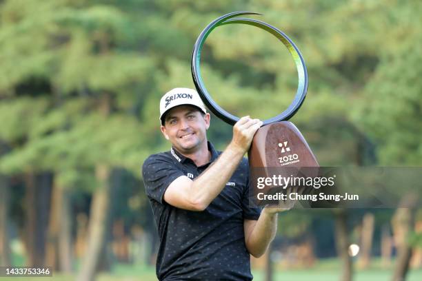 Keegan Bradley of the United States lifts the trophy at the award ceremony after winning the tournament following the final round of the ZOZO...