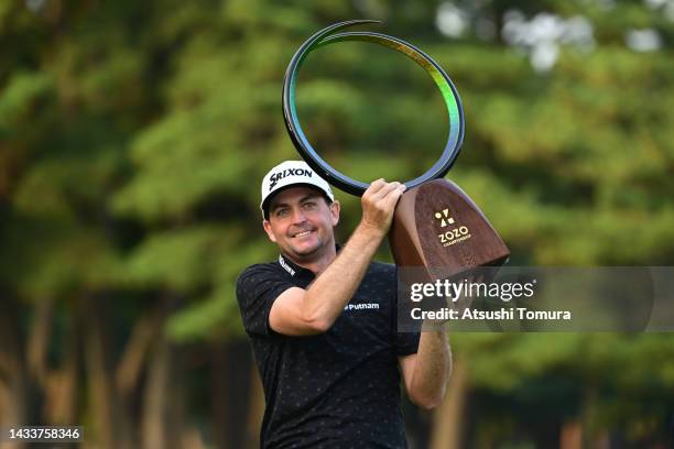 Keegan Bradley of the United States lifts the trophy at the award ceremony after winning the tournament following the final round of the ZOZO...