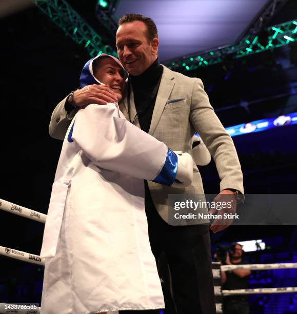 Astrid Wett is congratulated by Boxing promoter Kalle Sauerland after beating Keeley Colbran during the prelim match between Astrid Wett and Keeley...