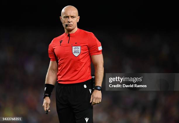 The referee Szymon Marciniak looks on during the UEFA Champions League group C match between FC Barcelona and FC Internazionale at Spotify Camp Nou...