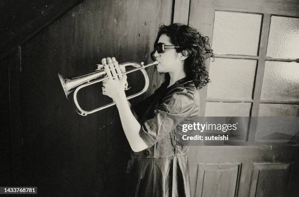 completely in the music. - trumpet stock pictures, royalty-free photos & images