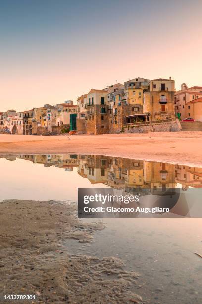 majestic reflection of the small fisherman town of cefalù at sunrise, palermo province, sicily, italy - giacomo palermo stock pictures, royalty-free photos & images