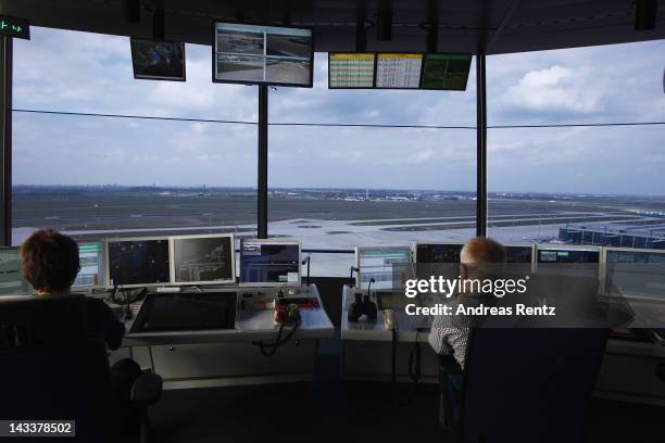 Air traffic controllers look out onto the tarmac following the official inauguration of the new control tower at Willy Brandt Berlin Brandenburg...