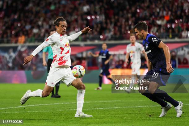 Yussuf Poulsen of RB Leipzig controls the ball next to Marc Oliver Kempf of Hertha Berlin during the Bundesliga match between RB Leipzig v Hertha BSC...