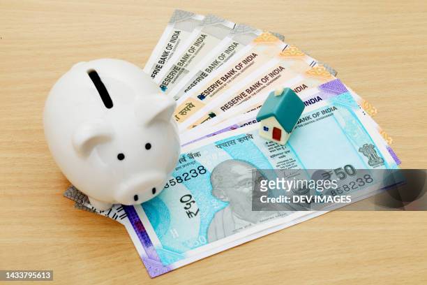 indian currency notes,piggy bank model home - rupee stock pictures, royalty-free photos & images