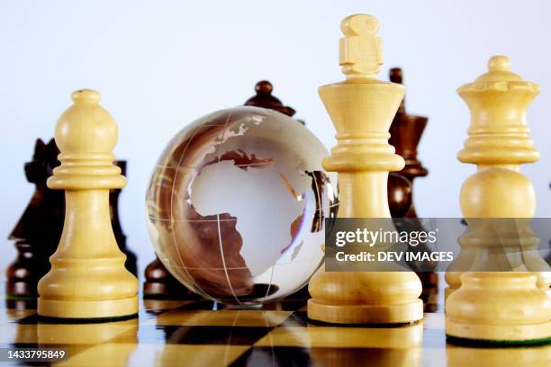 glass globe and chess pieces,close up - glass map india stock pictures, royalty-free photos & images