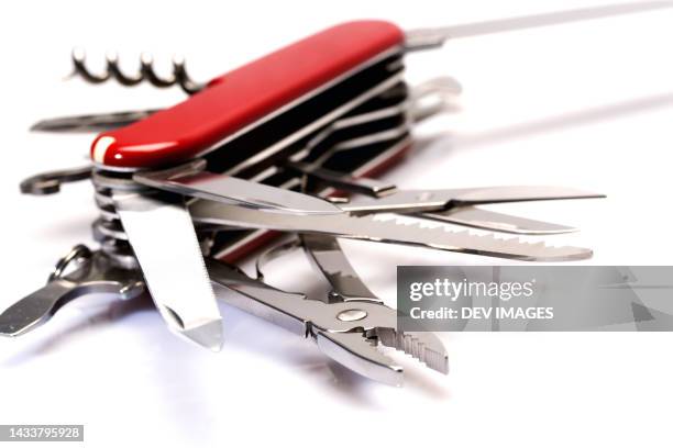 multi purpose knife against white background - coltellino svizzero foto e immagini stock