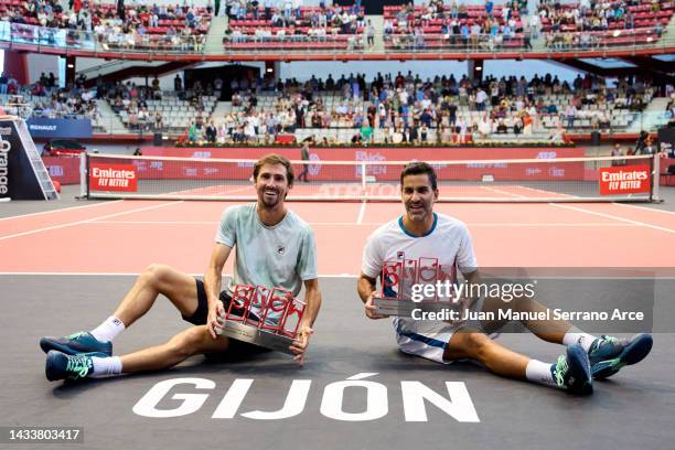 Maximo Gonzalez and Andres Molteni of Argentina celebrate with the trophy after winning match point against Nathaniel Lammons and Jackson Withrow of...