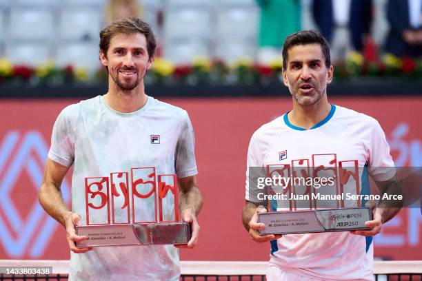 Maximo Gonzalez and Andres Molteni of Argentina celebrate with the trophy after winning match point against Nathaniel Lammons and Jackson Withrow of...