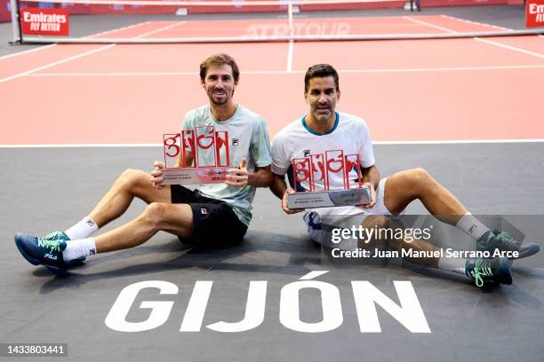 Maximo Gonzalez and Andres Molteni of Argentina celebrate with the trophy after winning match point against Nathaniel Lammons and Jackson Withrow of...