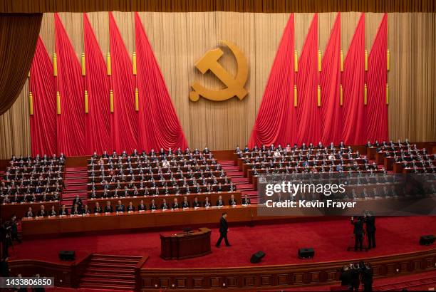 Chinese President Xi Jinping, bottom, is applauded by senior members of the government and delegates as he leaves the podium after his speech during...