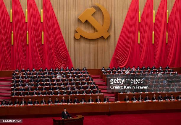 Chinese President Xi Jinping, bottom left, speaks during the Opening Ceremony of the 20th National Congress of the Communist Party of China at The...