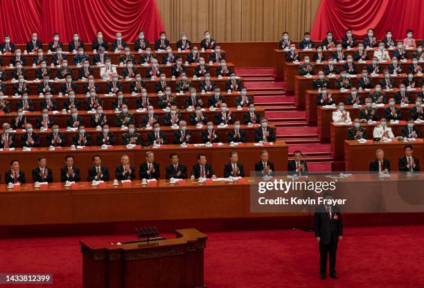 Chinese President Xi Jinping, bottom right, is applauded by senior members of the government and delegates as he stands before his speech during the...