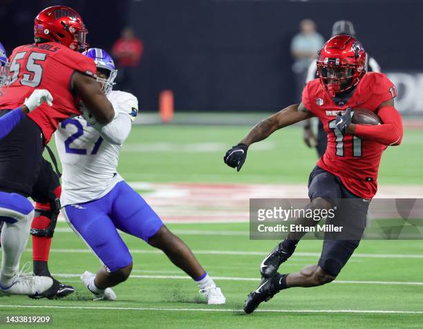 Wide receiver Ricky White of the UNLV Rebels runs against the Air Force Falcons during their game at Allegiant Stadium on October 15, 2022 in Las...