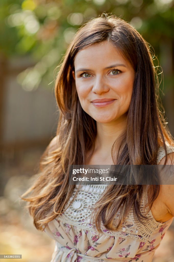 Smiling Caucasian woman standing outdoors