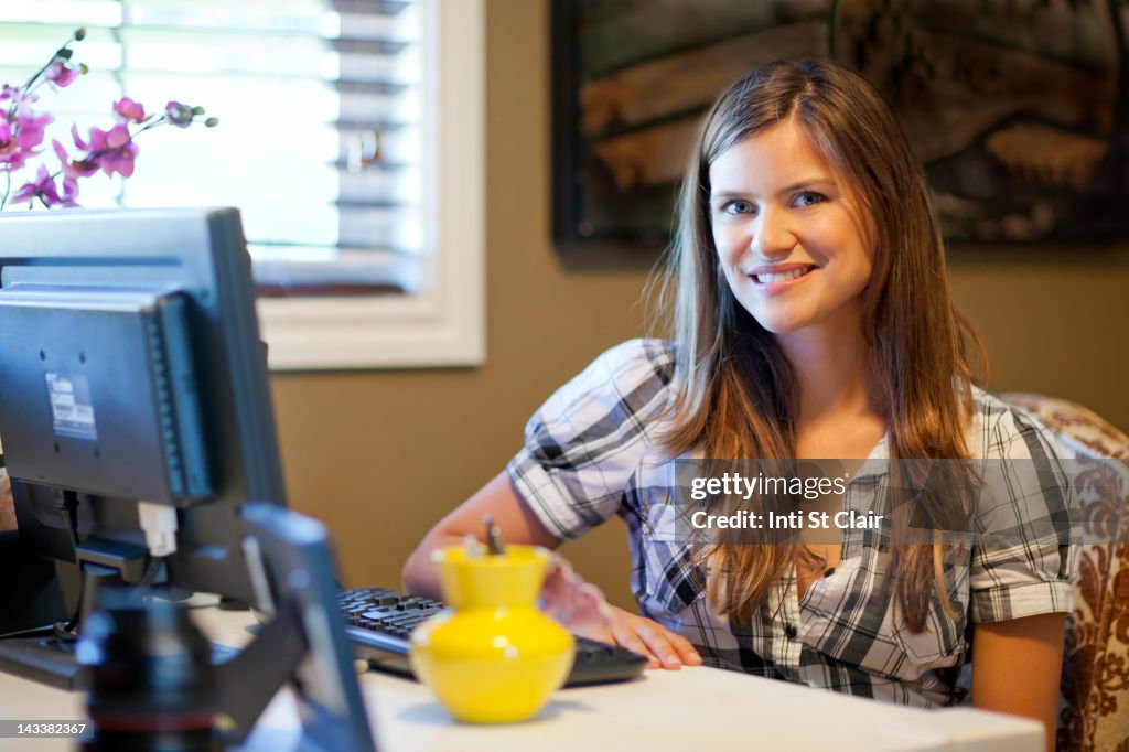 Caucasian woman using computer