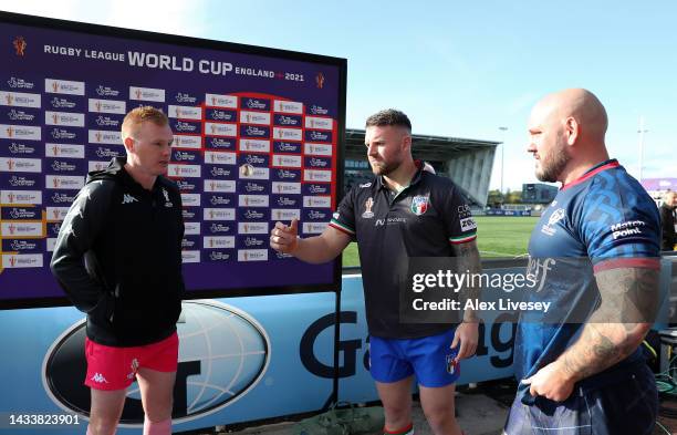 Nathan Brown of Italy flips the coin as Dale Ferguson of Scotland looks on ahead of the Rugby League World Cup 2021 Pool B match between Scotland and...