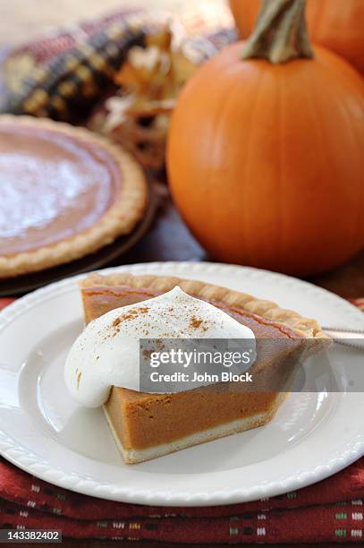 fresh, homemade pumpkin pie with whipped cream - pumpkin pie stock pictures, royalty-free photos & images