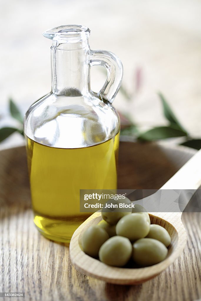 Olives and olive oil in jug