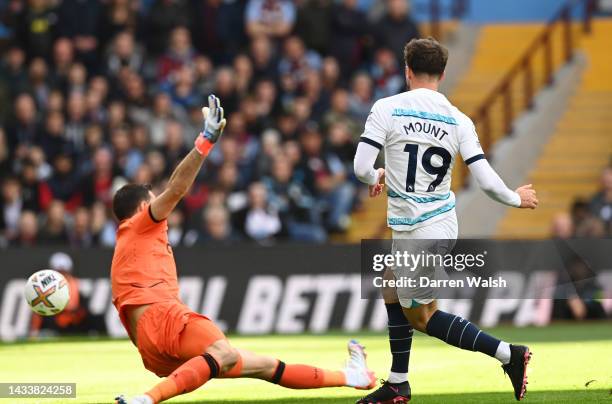 Mason Mount of Chelsea scores their team's first goal past Emiliano Martinez of Aston Villa during the Premier League match between Aston Villa and...