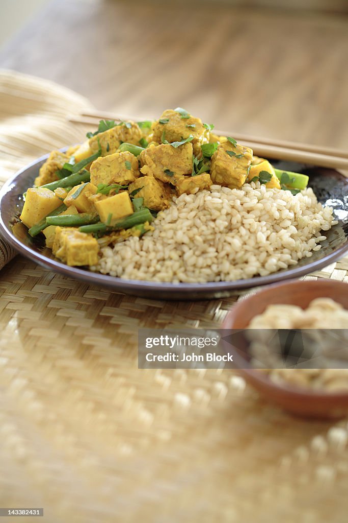 Curry soy tempeh and rice in bowl